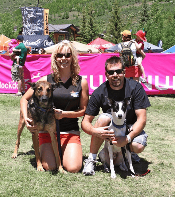 lianne shinton and brett geller with their dogs at a dog sporting event